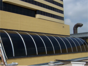 Bronze barrel vault skylight over hotel