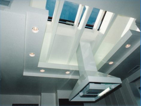 A kitchen with an open skylight design